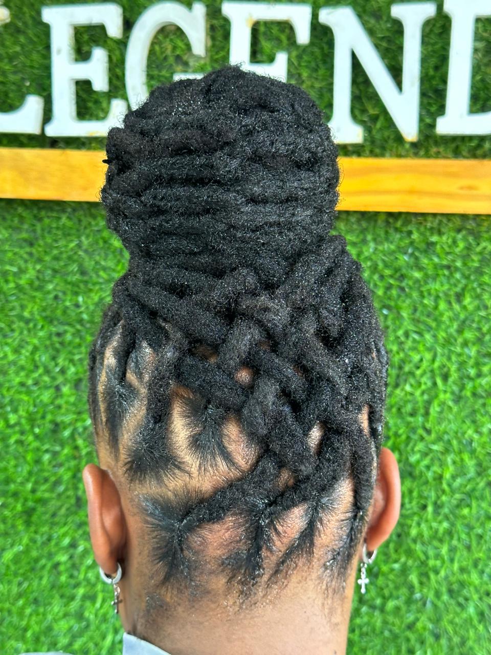Back view of locs criss-crossed up into a bun